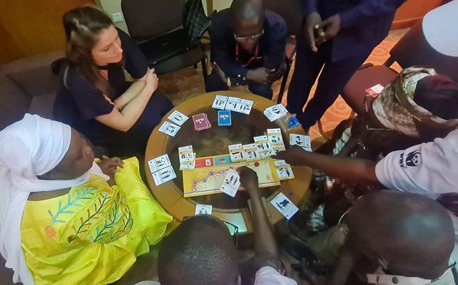 Group of people playing the game “ALERT” 