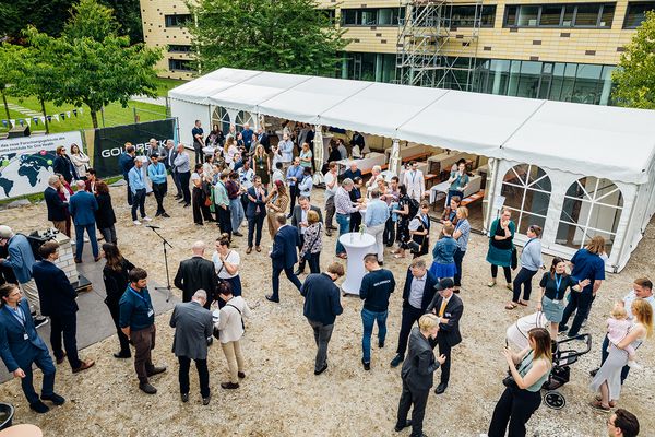 Researchers, partners and guests gather for the ceremonial laying of the foundation stone 