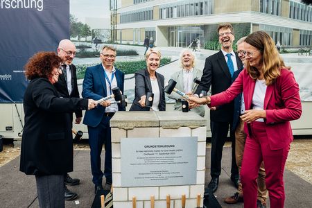With great enthusiasm, the time capsule is being sealed.
